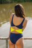 Trikini marino y amarillo  modelo Costa con aberturas delanteras y tejido cruzado de Moutt Girls.